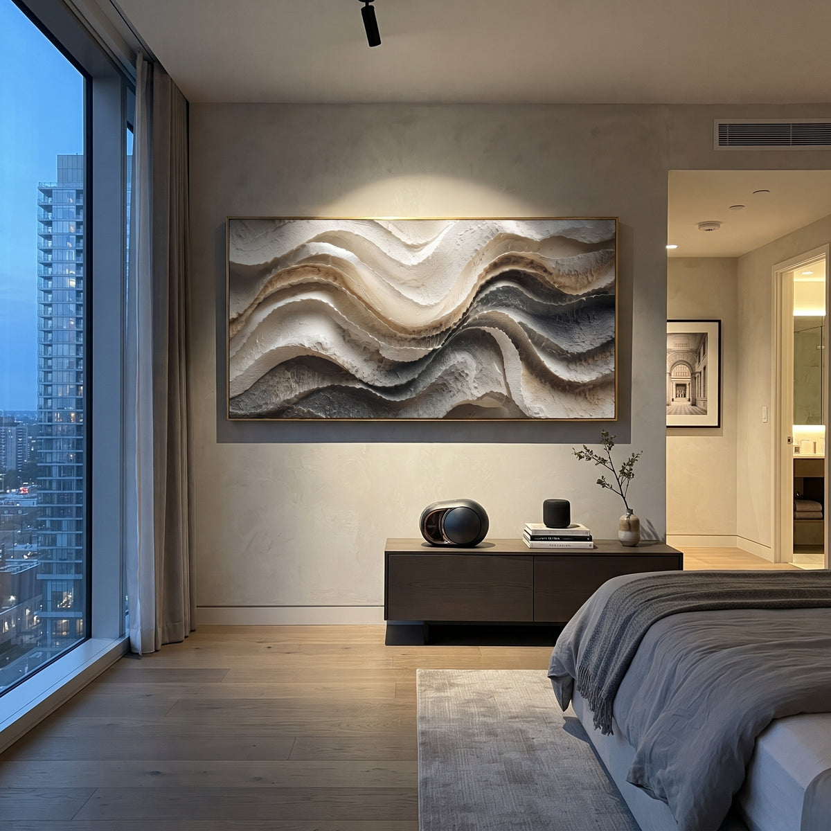 Fanned Calm Drift Relief focuses on white, beige, grey raised plaster waves with folded contour bands, soft dune-like ridges, and quiet negative space across the panoramic composition, keeping the product description tied to the visible artwork rather than a generic texture category. The composition is built from layered ridges, carved plaster edges, curved bands, granular breaks, and raised channels that move across the canvas with a clear directional rhythm. Pale passages, darker accents, warm